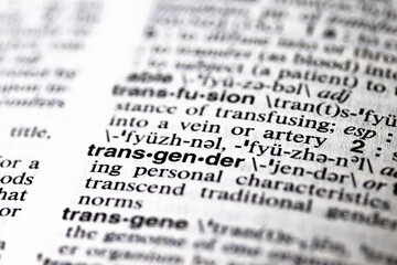printed word transgender on dictionary page close-up macro definition current events, social issues