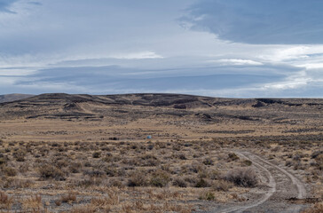A dirt road curves through a desert ranch in western Nevada, USA