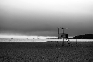 Selective focus. Beach in bad weather. Closing of the swimming season.
