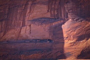 Cliff dwellings, Canyon de Chelle, Arizona. Amazing geology showing in sun and shade on the cliff face.