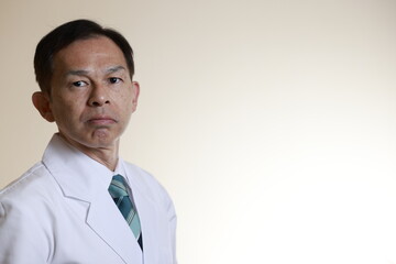 Middle-aged Asian doctor in a white coat on white background. Concept image of regenerative medicine, vaccine development and advanced therapy.