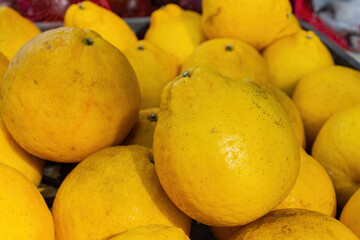 Close up shot of many Pomelo selling in a market