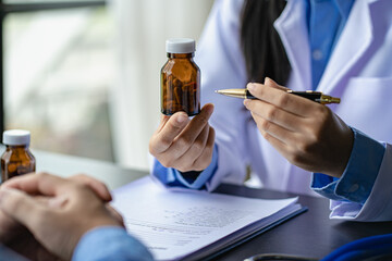 Psychiatrist consulting on women's gynecological diseases, writing prescription clipboard notes, listening to patients received in the clinic hospital.