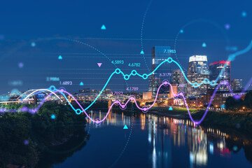 Panoramic view of Broadway district of Nashville over the river at illuminated night skyline, Tennessee, USA. Forex candlestick graph hologram. The concept of internet trading, brokerage and analysis
