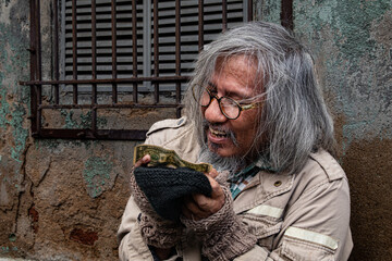 Poverty man meet financial crisis ask for food live on sidewalk, dirty homeless aged man with beard...