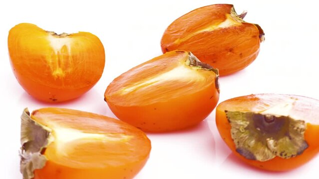 sliced persimmon isolated on white background