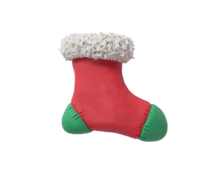 Red and green sock with snowflakes made of plasticine. Gingerbread cookie in the shape of a Christmas boot, handmade with plasticine. Christmas greeting card concept