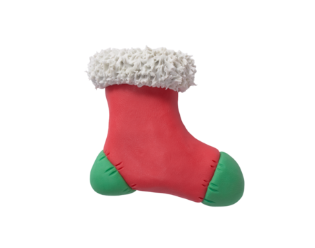 Red and green sock with snowflakes made of plasticine. Gingerbread cookie in the shape of a Christmas boot, handmade with plasticine. Christmas greeting card concept