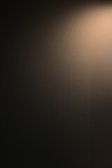 brown wall background with lights and black shadow