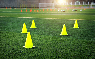 Group of football training cones on the soccer field © xy