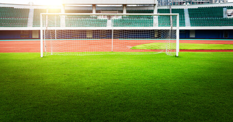 Empty soccer ball green grass field