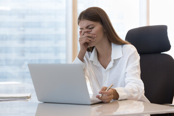 Tired frustrated office employee girl getting problems with laptop, software error, app wrong work,...