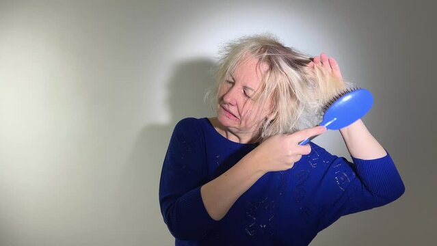 hairdressing medicine hair restoration damaged split ended hair Overdried spoiled adult woman blond coloring white Damaged Sad Woman With Disheveled Closeup Portrait Of Female Model Holding Unbrushed 