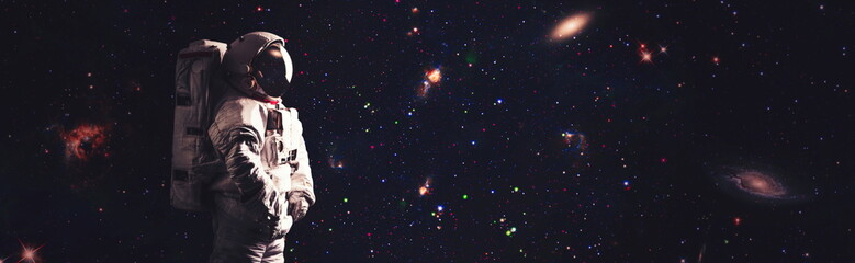 Astronaut in outer space , Cosmic art, science fiction wallpaper. Beauty of deep space. Elements of this image furnished by NASA © Maximusdn