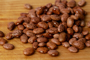 Pinto beans are dried on wooden board