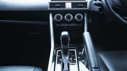 close-up of car start and stop buttons. Modern car interior with cockpit dashboard and steering...