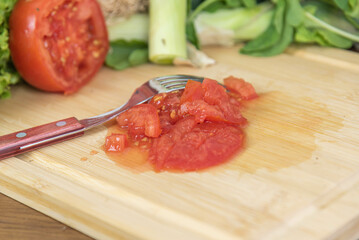 Vegetables cut on wooden board.