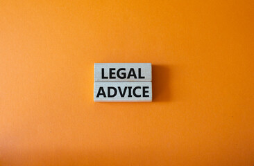 Legal advice symbol. Wooden blocks with words Legal advice. Beautiful orange background. Business and Legal advice concept. Copy space.