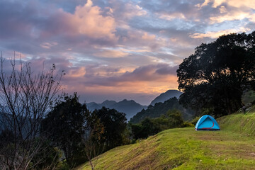 Fototapeta na wymiar mountain landscape and tent dramatic evening sky