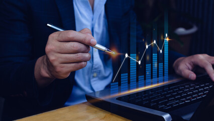 Businessman stylus pen touch points symbol stock graph and chart background, concept growth and development business investment, Stock market and strategy making market plan 