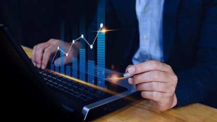 Fototapeta premium Businessman stylus pen touch points symbol stock graph and chart background, concept growth and development business investment, Stock market and strategy making market plan 