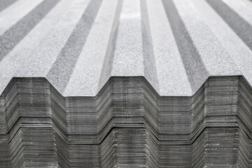 Metal profile for roof covering. Metal profiled sheeting is stored in a bundle in a warehouse for...