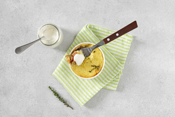 shepherd's pie served in the plate with a sourcream and thyme , top view