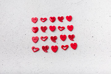 Set of red decorative heart-shaped buttons on white background. Ornamental details for sewing,...