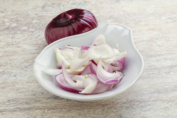 Sliced red onion in the bowl