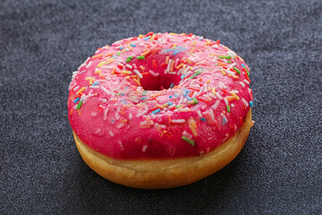 Sweet glazed struwberry donut with icing