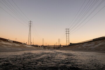 Beautiful view of LA river with 6th street bridge against sunset