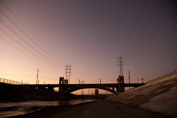 Beautiful view of LA river with 6th street bridge against sunset