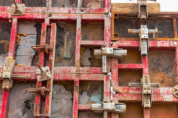 Reinforced concrete foundation of a modern monolithic residential building. Prepared formwork with reinforcing mesh for pouring concrete. Monolithic construction technologies.