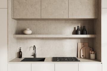 Beige cooking space interior with sink and stove with kitchenware