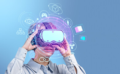 Businesswoman in vr glasses and virtual reality hud hologram with glowing icons © ImageFlow