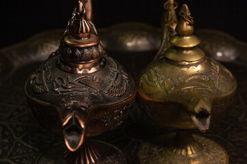 Aladdin's magic lamp isolated on black background