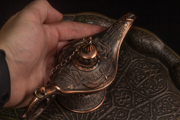 Aladdin's magic lamp isolated on black background