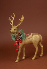 Beautiful figurine of Christmas golden Scandinavian deer