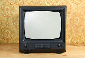 Vintage Television on wooden antique closet, old design in a home