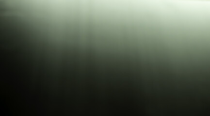 Blurred abstract background and black and white gradient. Black bottom and white light reflects from above and blurs.