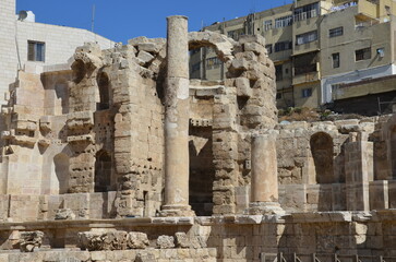 Fototapeta na wymiar Ancient ruins of Greek and Roman buildings in the Citadel of Amman on a bright sunny day.
