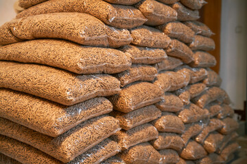 Wood Pellets toilet. Wooden compressed pellet cylindric rolls with diameters of 6mm are used for heating households. Eco-renewable biofuel.