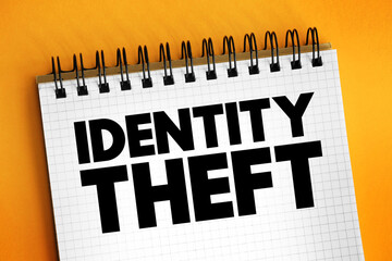 Identity theft occurs when someone uses another person's personal identifying information, to commit fraud or other crime, text concept on notepad