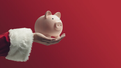 Santa Claus holding a piggy bank