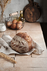 A sourdough bread on table tiles with rustic conceptual
