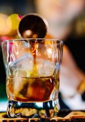 woman hand bartender making cocktail in bar