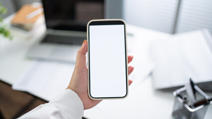Cropped shot view of Women's hands holding cell telephone blank copy space screen. smart phone with technology concept