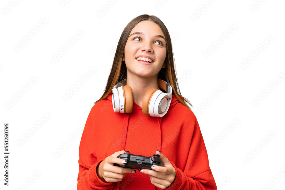 Poster Teenager caucasian girl playing with a video game controller over isolated background laughing