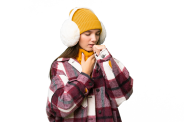 Teenager caucasian girl wearing winter muffs over isolated background is suffering with cough and feeling bad
