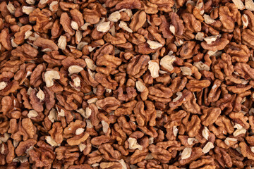 background of peeled walnuts close up top view